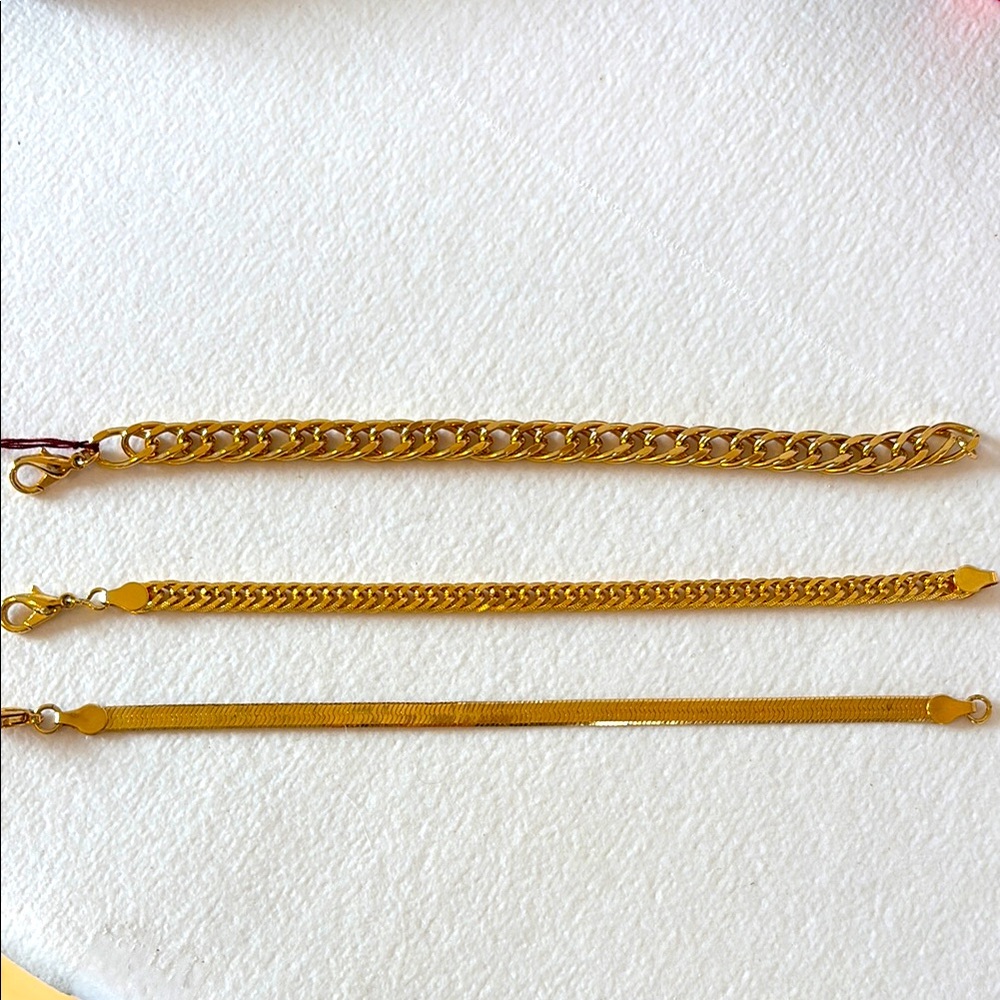 Gold Vermille Chain Bracelet Trio with Intricate Designs..